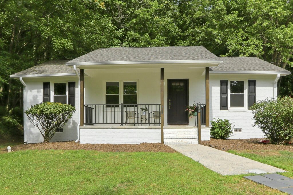 Front exterior and covered porch of 707 Dickens Street in Roxboro, North Carolina