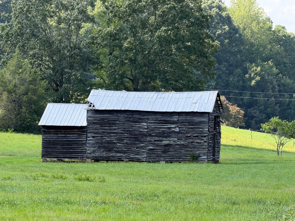 Historic weathered barn in the Rougemont, North Carolina countryside